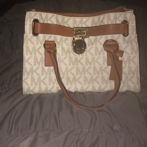 Michael Kors logo snap closure handbag.